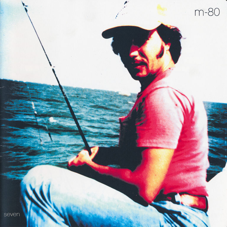The front cover of m-80 | seven featuring a man fishing on a lake